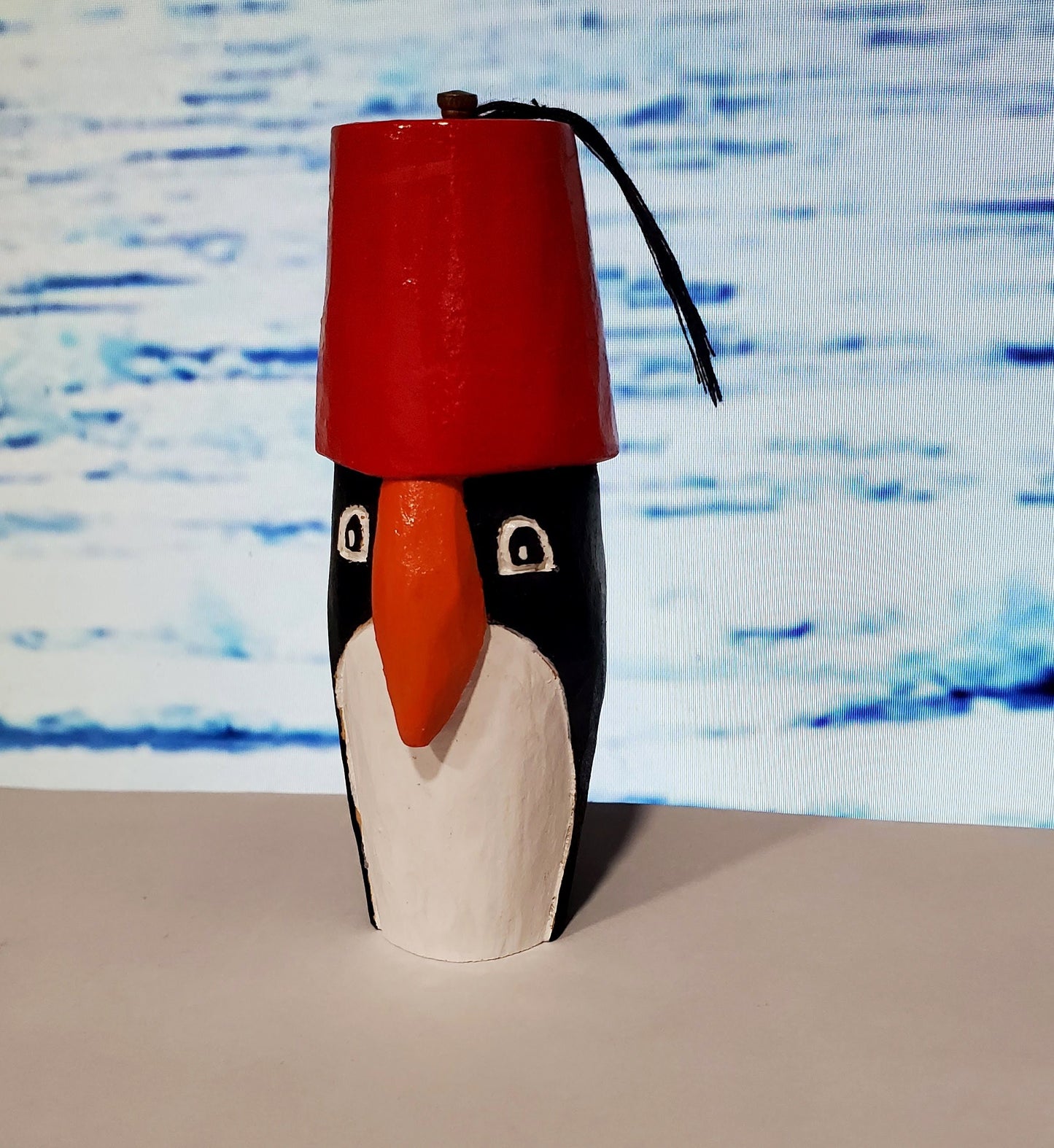 Hand carved Penguin in a Fez