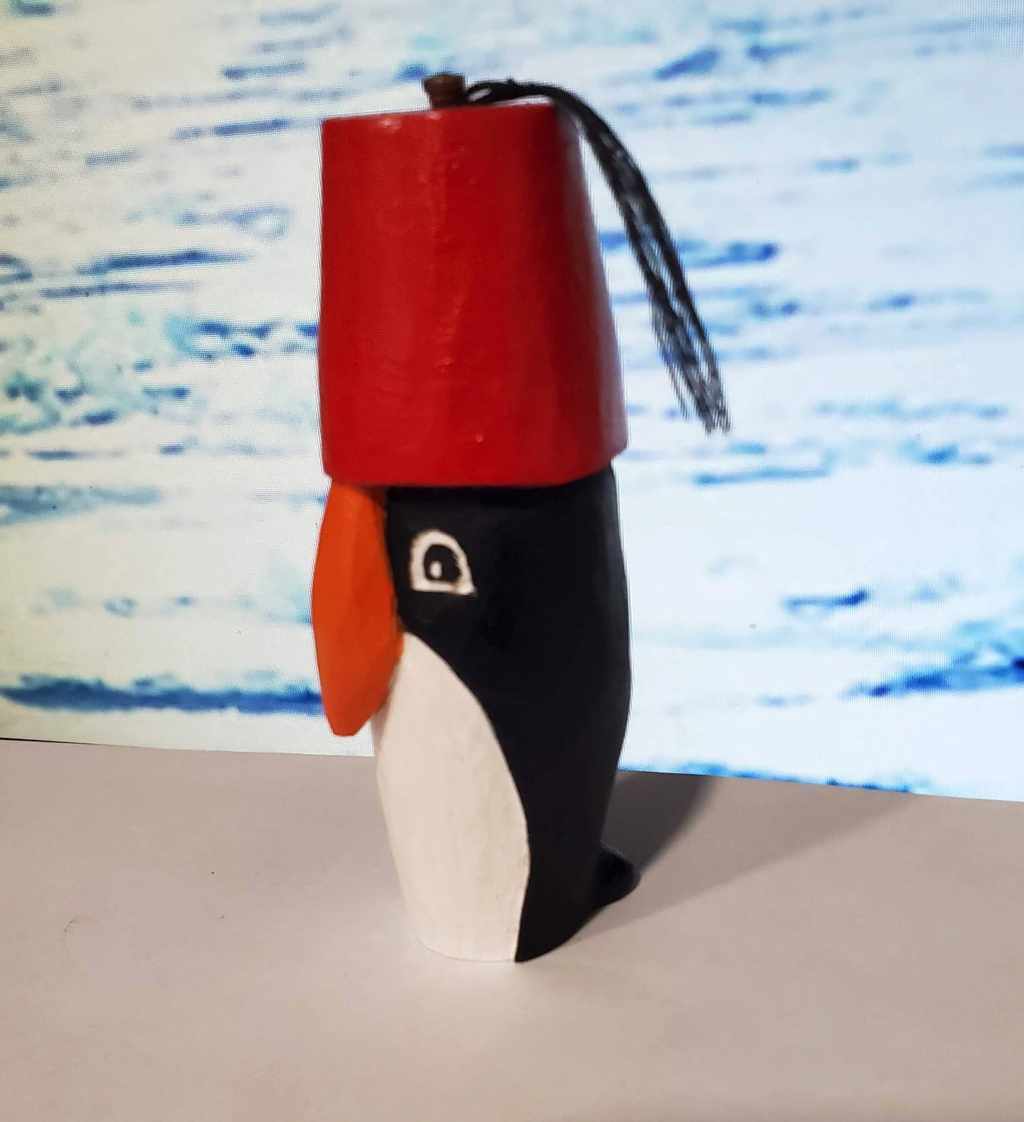 Hand carved Penguin in a Fez
